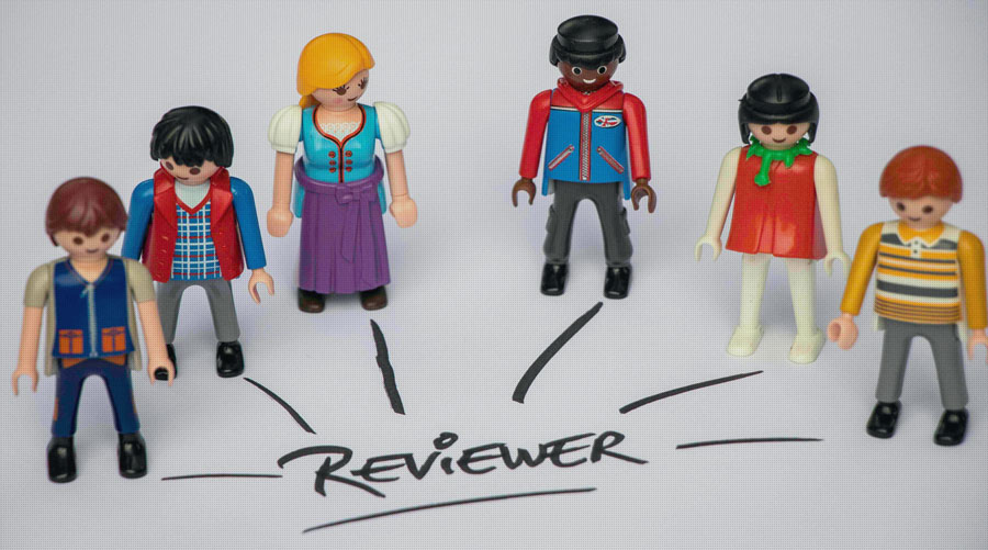 Six persons standing as six reviewers