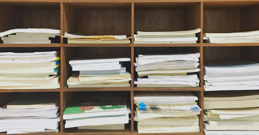 shelf with academic papers