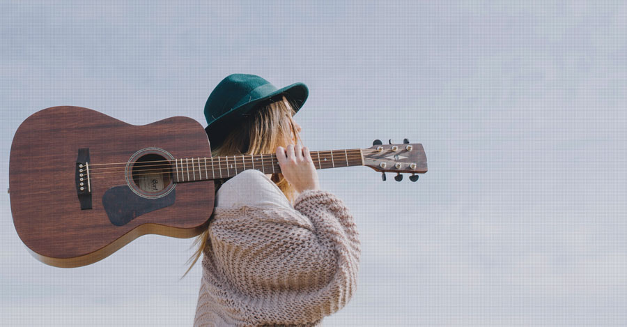Woman with guitar enjoying her life!