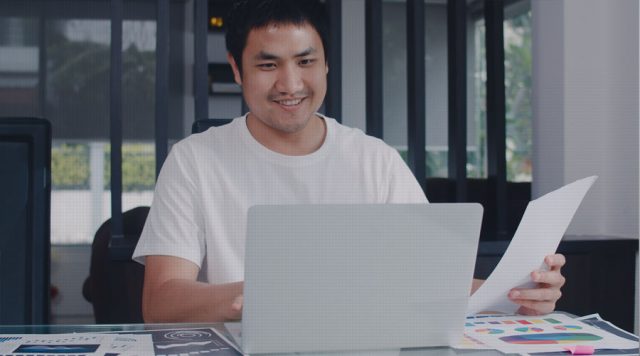 PhD student with laptop