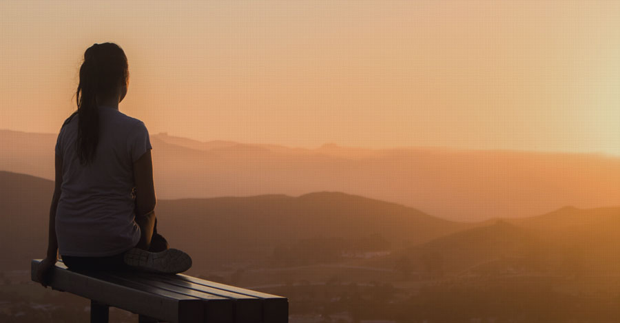 woman watching sunrise