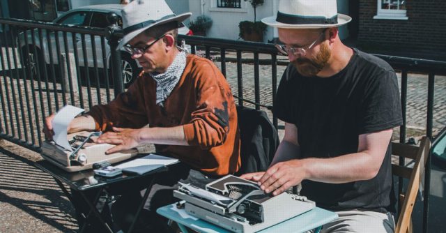 men reviewing paper