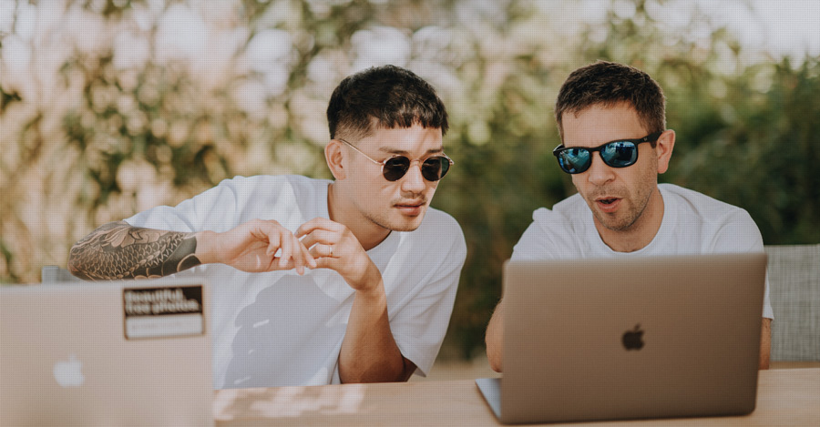 two scientists writing together